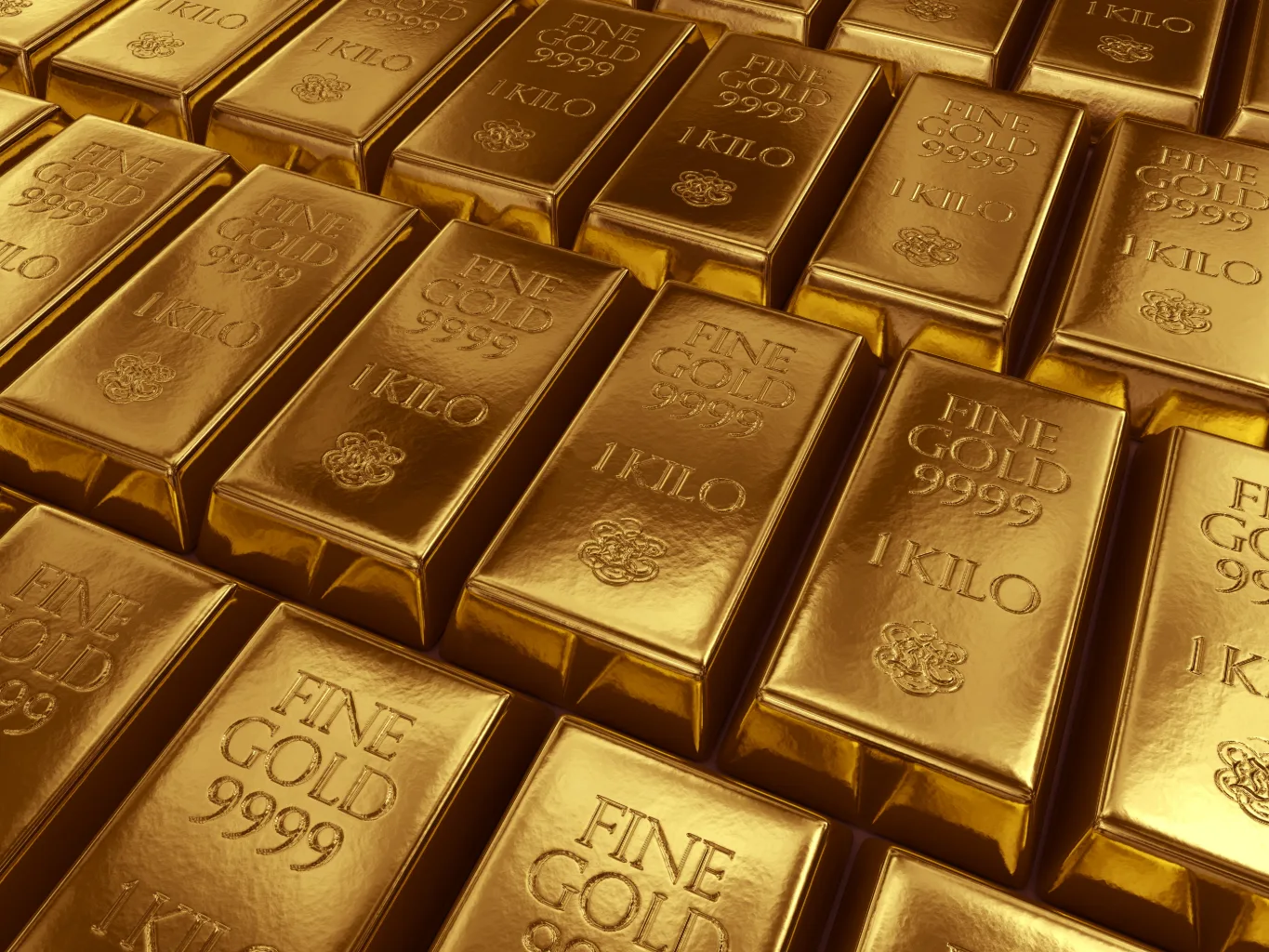 At the offer stage of a gold and silver purchase, a worker uses a calculator beside grouped metal items and an evaluation note, totaling the offer before presenting it